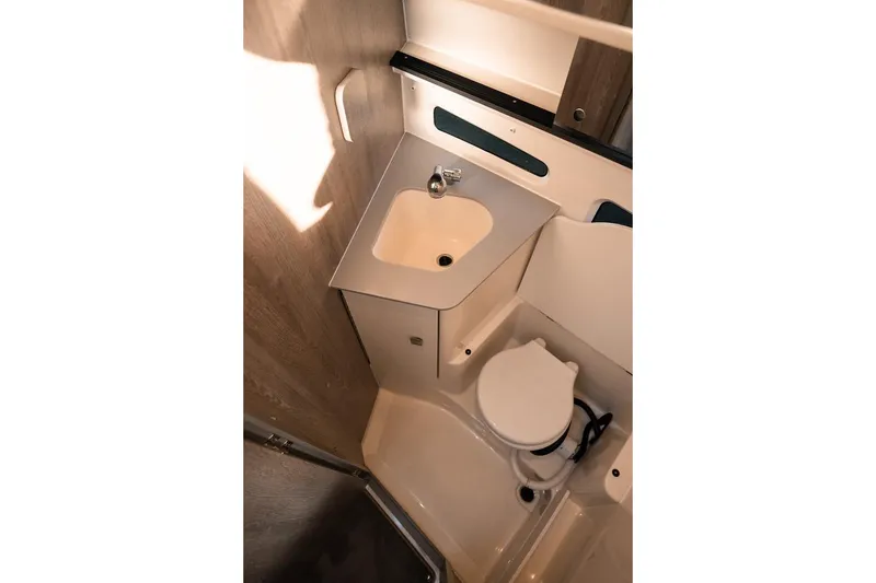 Slide: The Image of Compact bathroom in 2026 Trophy T29 Explorer, featuring sink and toilet. - 14