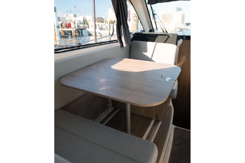 Slide: The Image of Interior of 2026 Trophy T29 Explorer boat with wooden table and seating. - 16