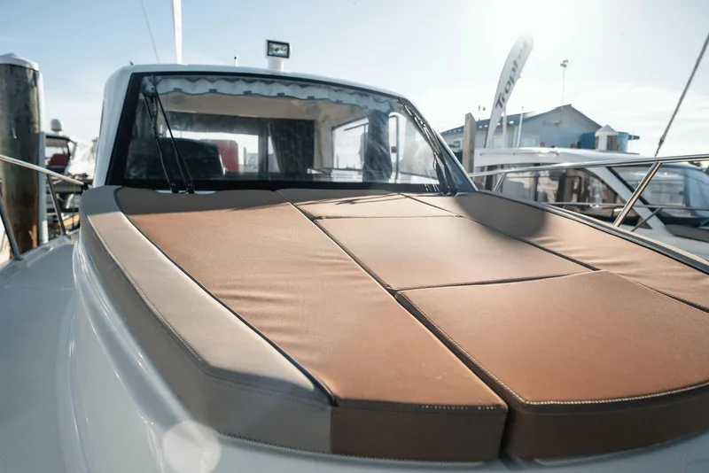 Slide: The Image of 2026 Trophy T29 Explorer boat with cushioned deck in marina setting. - 19