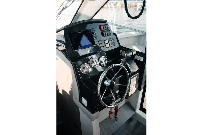 Slide: The Image of Helm of 2026 Trophy T29 Explorer boat with modern controls and navigation system. - 21