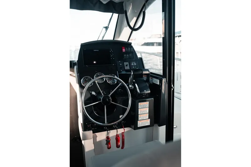 Slide: The Image of Helm of 2026 Trophy T29 Explorer boat with steering wheel and control panel. - 22