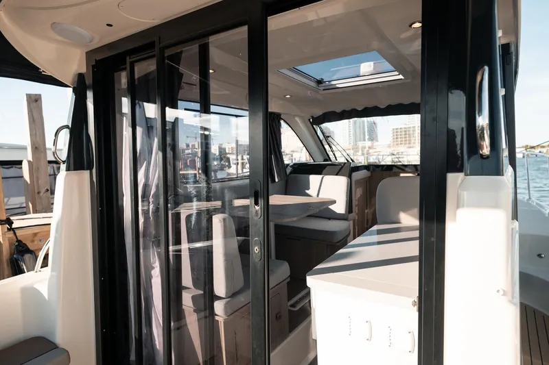 Slide: The Image of Interior view of 2026 Trophy T29 Explorer boat with modern seating and table. - 24