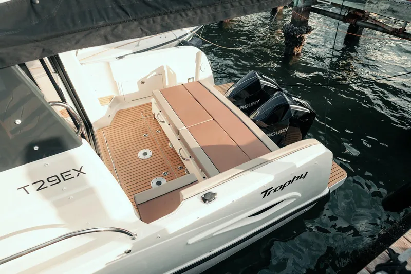 Slide: The Image of 2026 Trophy T29 Explorer boat with dual Mercury engines docked on water. - 27