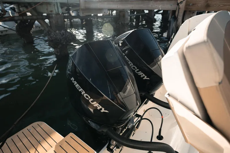 Slide: The Image of 2026 Trophy T29 Explorer with dual Mercury outboard engines at dock. - 29