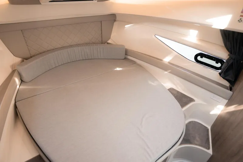 Slide: The Image of Interior cabin of 2026 Trophy T29 Explorer boat, featuring a cozy bed and modern design. - 9