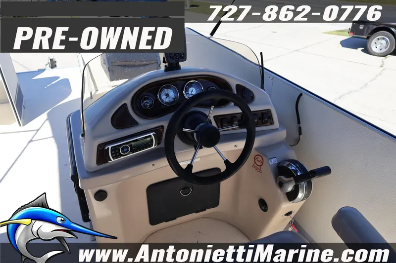 Slide: The Image of Pre-owned 2017 Fiesta 20 FISH boat dashboard with steering wheel and controls. - 16