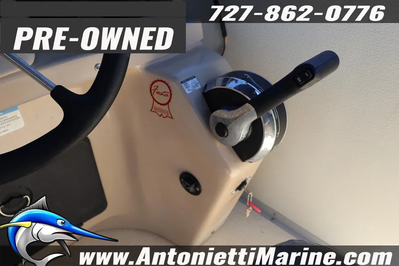 Slide: The Image of Pre-owned 2017 Fiesta 20 FISH boat controls, featuring steering wheel and throttle. - 20