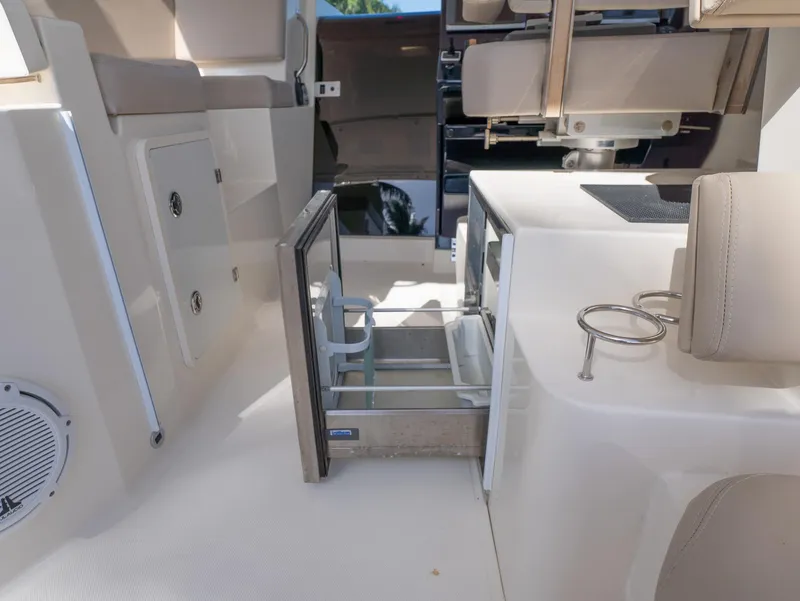 Slide: The Image of 2014 Pursuit SC 365i Sport Coupe interior with open storage and seating. - 13