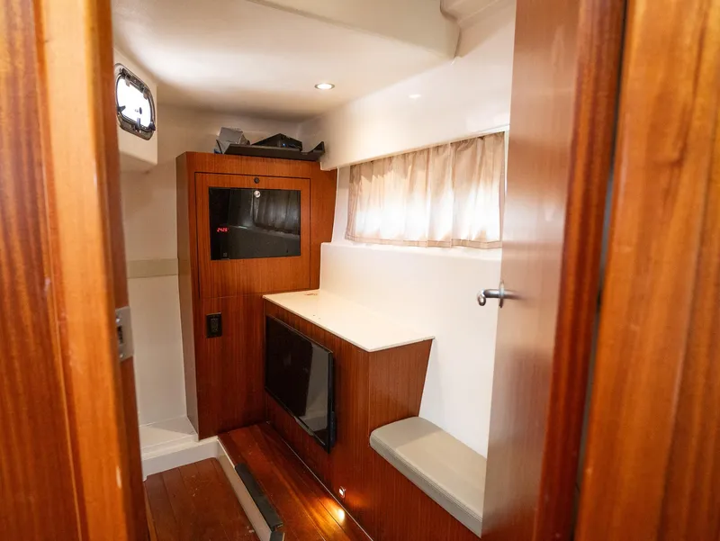 Slide: The Image of Interior cabin of 2014 Pursuit SC 365i Sport Coupe with wood finish and seating. - 24