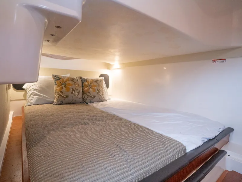 Slide: The Image of 2014 Pursuit SC 365i Sport Coupe cabin with cozy bed and floral pillows. - 25