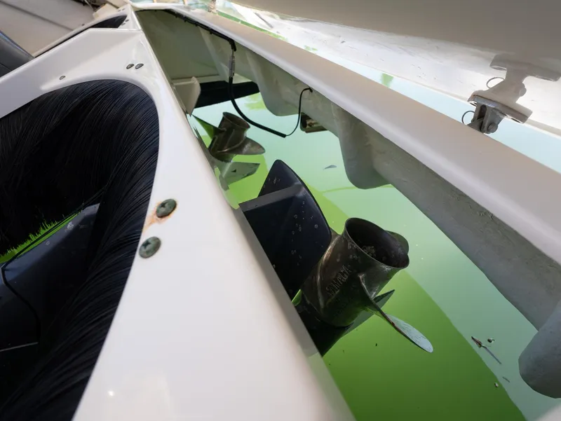 Slide: The Image of 2014 Pursuit SC 365i Sport Coupe propeller in water, close-up view. - 31