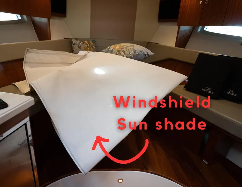 Slide: The Image of 2014 Pursuit SC 365i Sport Coupe interior with windshield sun shade displayed. - 32