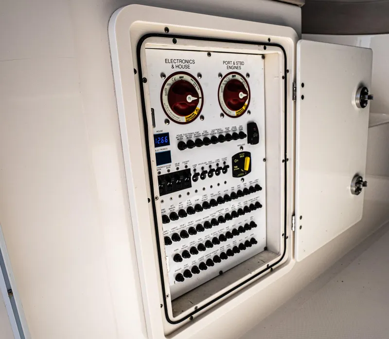 Slide: The Image of Electrical control panel on a 2014 Pursuit SC 365i Sport Coupe boat. - 35