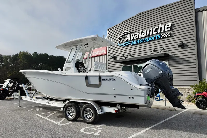 The Image of 2026 Sea Fox 268 Commander boat on trailer at Avalanche Motorsports dealership. - 1