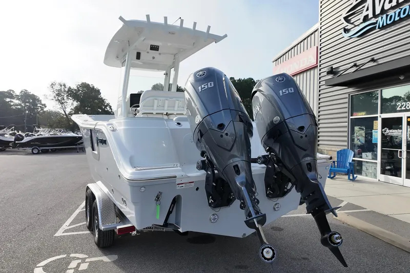 Slide: The Image of 2026 Sea Fox 268 Commander boat with dual Yamaha 150 engines at dealership. - 5