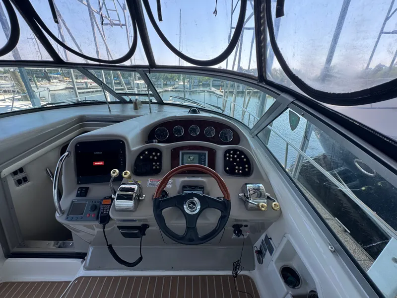 Slide: The Image of Helm of 2007 Sea Ray 340 Sundancer with steering wheel and control panel. - 10
