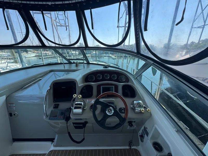 Slide: The Image of Cockpit view of 2007 Sea Ray 340 Sundancer yacht at marina. - 11