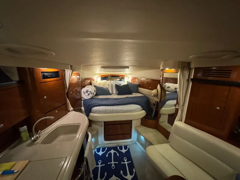 Slide: The Image of Luxurious interior of 2007 Sea Ray 340 Sundancer yacht with cozy bed and kitchenette. - 16