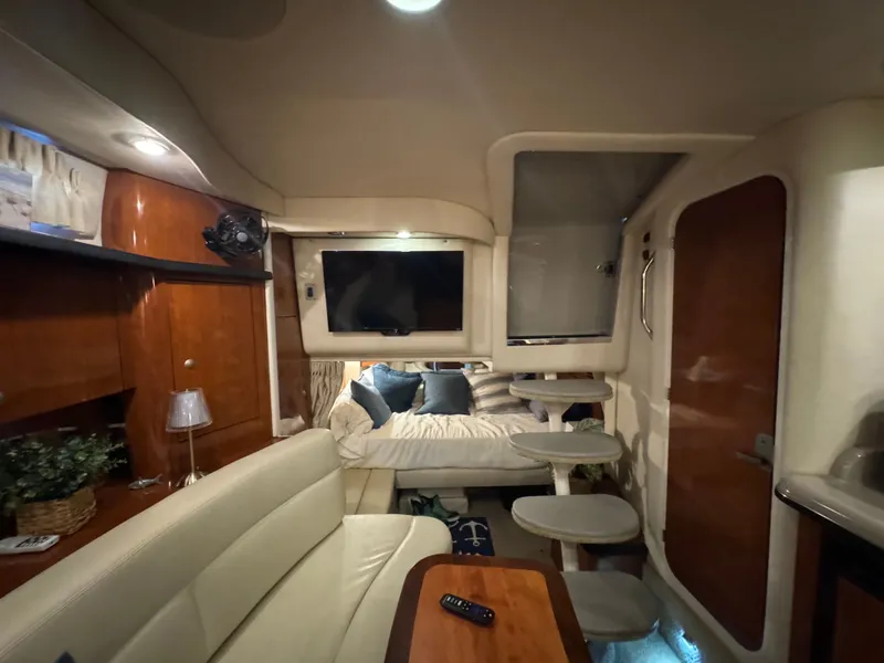 Slide: The Image of Interior of 2007 Sea Ray 340 Sundancer yacht with cozy seating and modern amenities. - 17