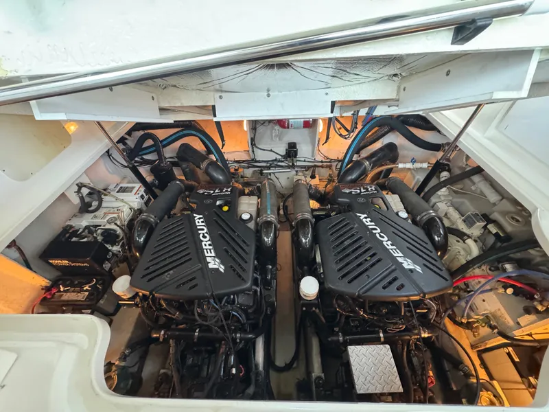 Slide: The Image of Engine compartment of a 2007 Sea Ray 340 Sundancer with twin Mercury engines. - 22