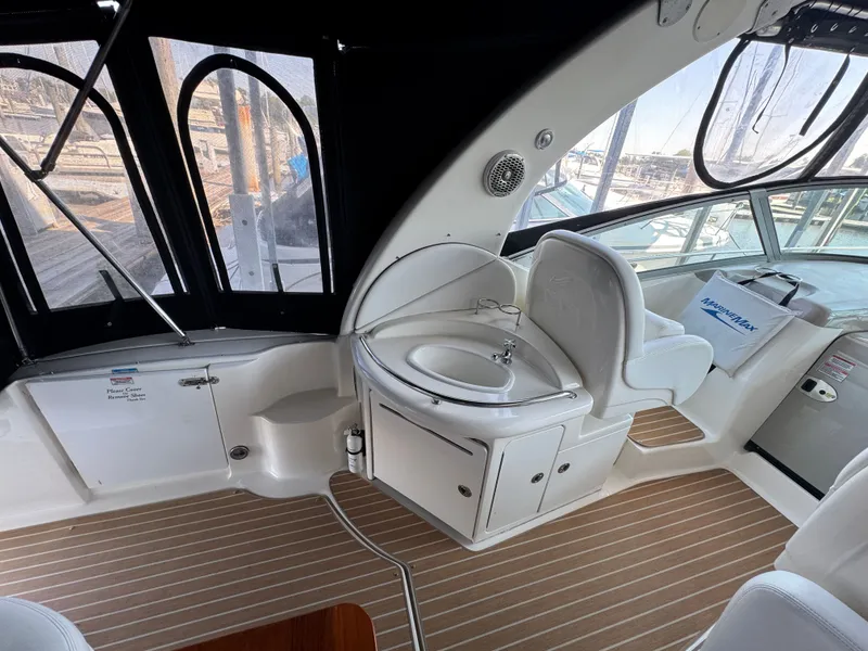 Slide: The Image of 2007 Sea Ray 340 Sundancer interior with helm, sink, and seating area. - 7