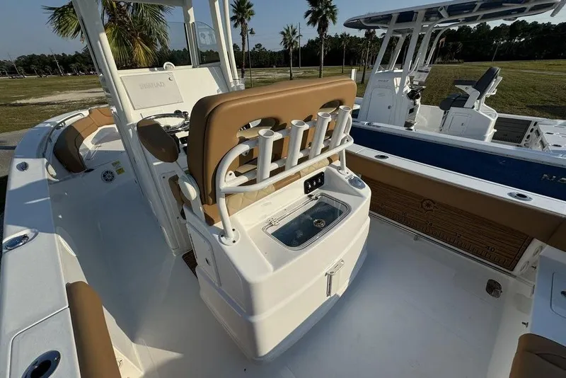 Slide: The Image of 2024 NauticStar 252 Legacy boat interior with seating and rod holders. - 24