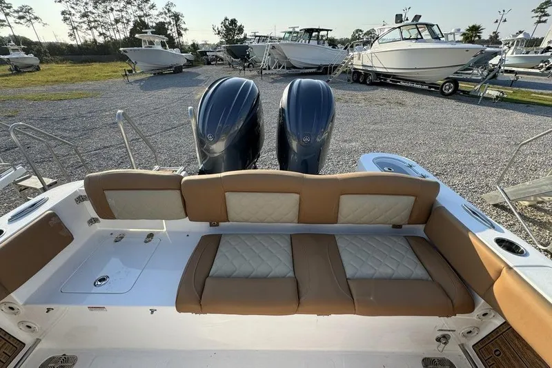 Slide: The Image of 2024 NauticStar 252 Legacy boat with dual engines and cushioned seating. - 28