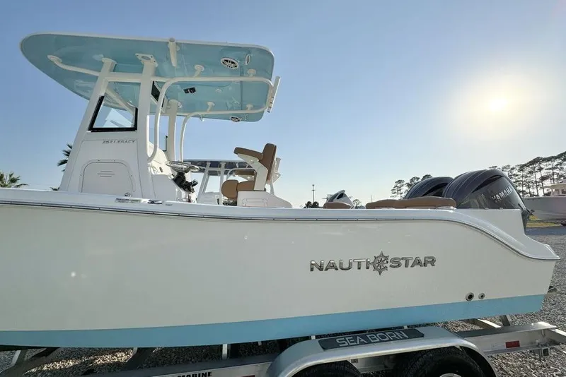 Slide: The Image of 2024 NauticStar 252 Legacy boat on trailer, side view, sunny day. - 3