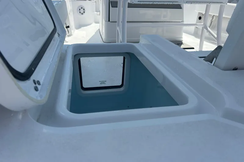 Slide: The Image of Open storage compartment on 2025 Sportsman Masters 227 Bay Boat, showcasing interior design. - 19