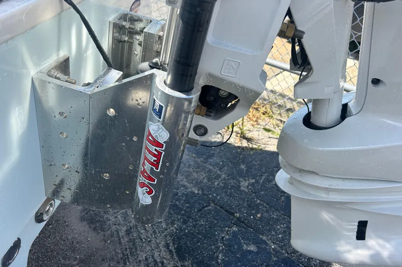 Slide: The Image of Close-up of 2025 Sportsman Masters 227 Bay Boat engine mount and hydraulic system. - 20