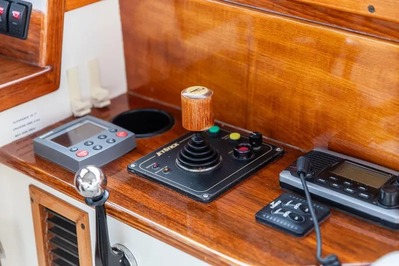 Slide: The Image of Hinckley Picnic Boat EP 2004 control panel with joystick and navigation equipment. - 16