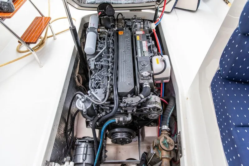 Slide: The Image of Engine compartment of a 2004 Hinckley Picnic Boat EP, showcasing detailed mechanical components. - 24