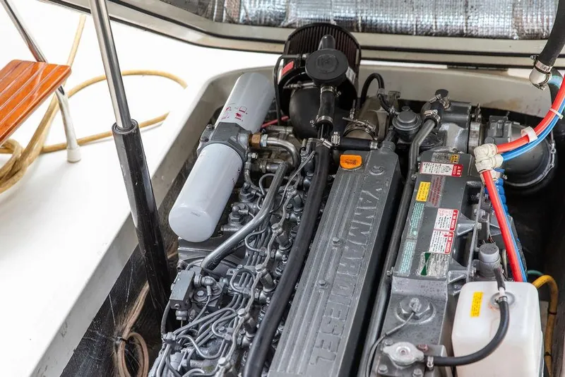 Slide: The Image of Engine compartment of a 2004 Hinckley Picnic Boat EP, featuring a Yanmar diesel engine. - 25