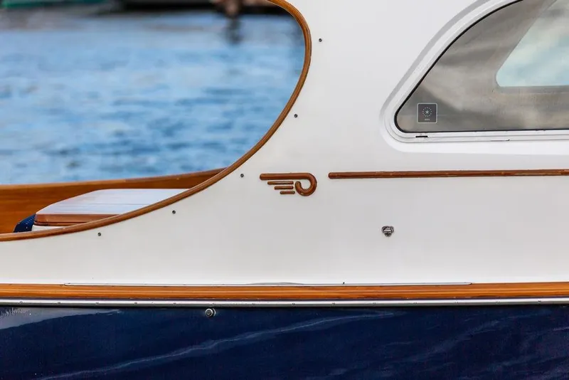 Slide: The Image of 2004 Hinckley Picnic Boat EP, elegant design detail with wood accents by the water. - 6