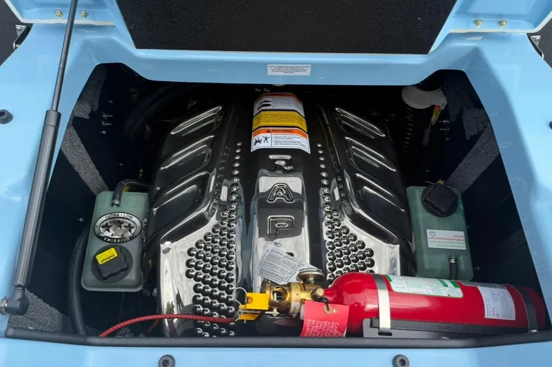 Slide: The Image of 2026 Supra SA 550 engine compartment with fire extinguisher and ultra-low emission label. - 10