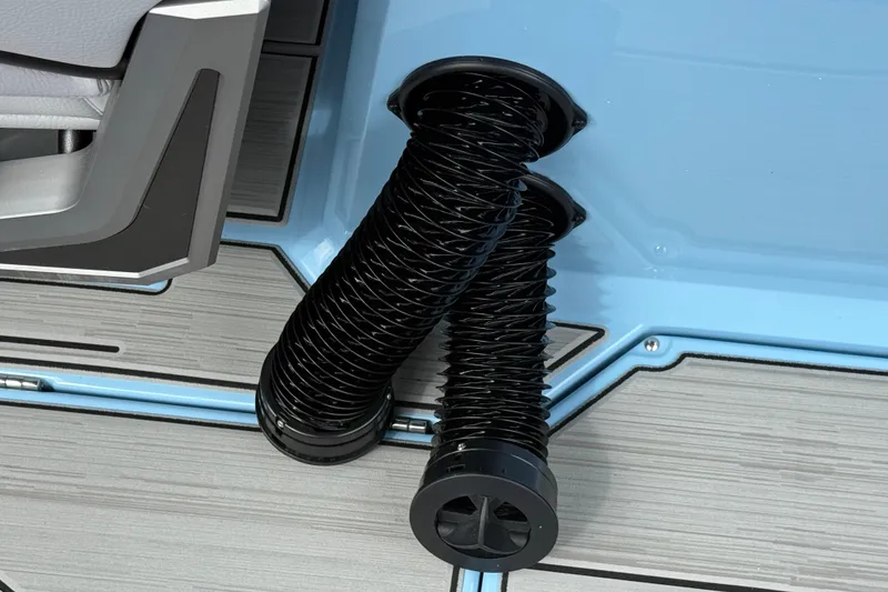 Slide: The Image of Black ventilation ducts on a blue and gray Supa SA 550 boat floor, 2026 model. - 18