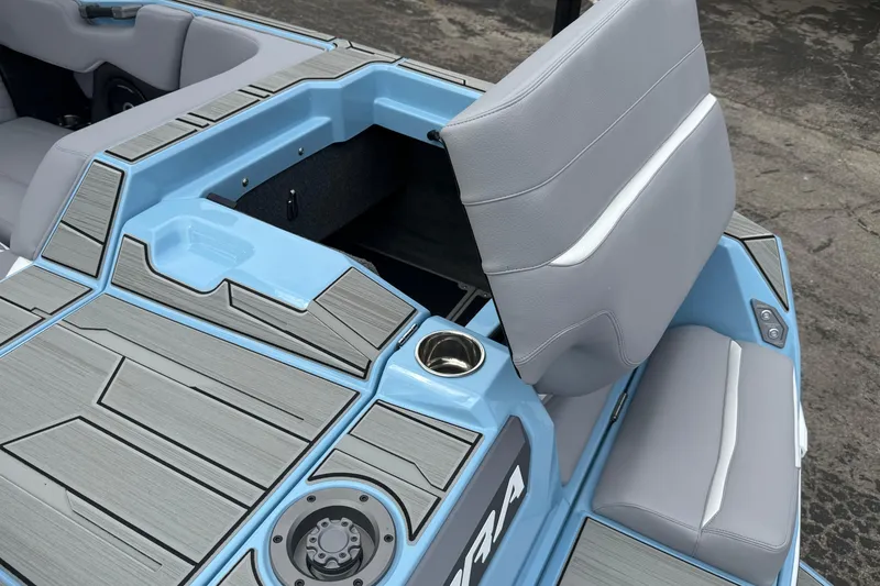 Slide: The Image of 2026 Supa SA 550 boat interior with gray seating and storage compartment. - 9