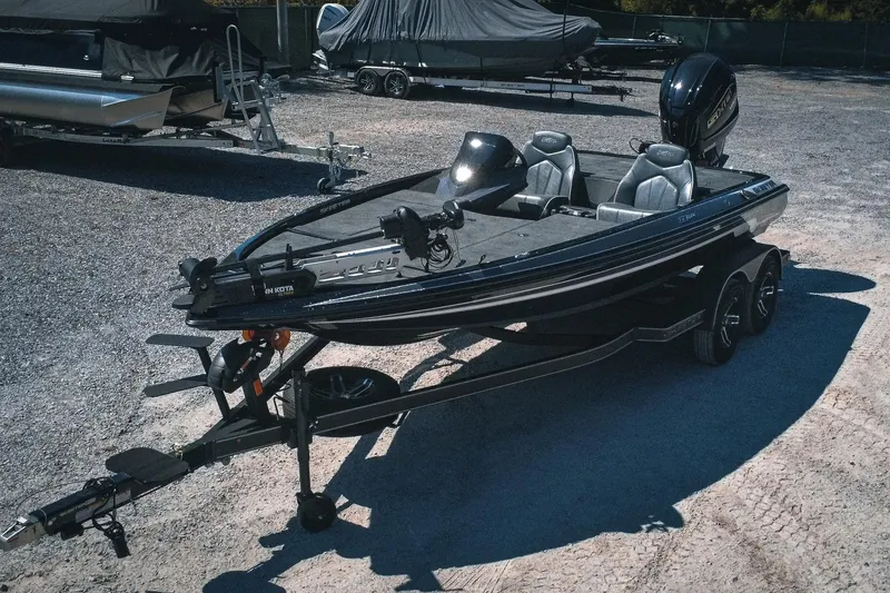 Slide: The Image of 2024 Skeeter ZX200 fishing boat on trailer in outdoor setting. - 10
