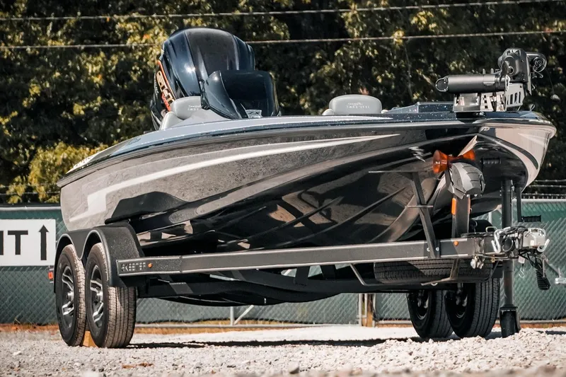 Slide: The Image of 2024 Skeeter ZX200 boat on trailer, parked outdoors, showcasing sleek design and modern features. - 11