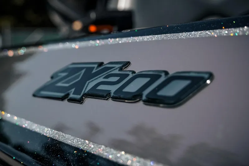 Slide: The Image of 2024 Skeeter ZX200 logo on a sleek, glittering surface. - 16