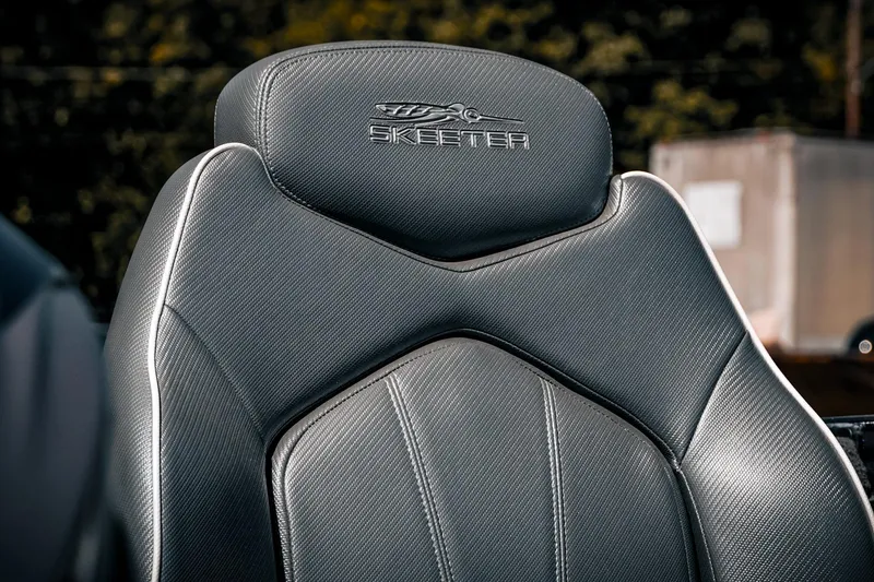 Slide: The Image of 2024 Skeeter ZX200 boat seat with sleek, textured design and embroidered logo. - 18