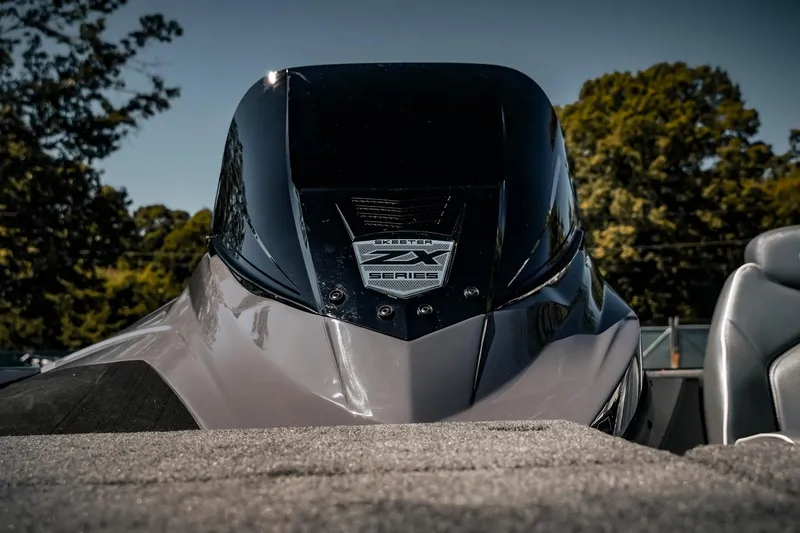 Slide: The Image of 2024 Skeeter ZX200 boat, sleek design with ZX Series emblem, outdoor setting. - 19