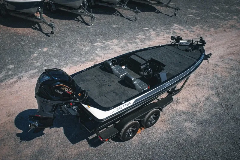 Slide: The Image of 2024 Skeeter ZX200 fishing boat with Yamaha engine, parked on a trailer. - 2