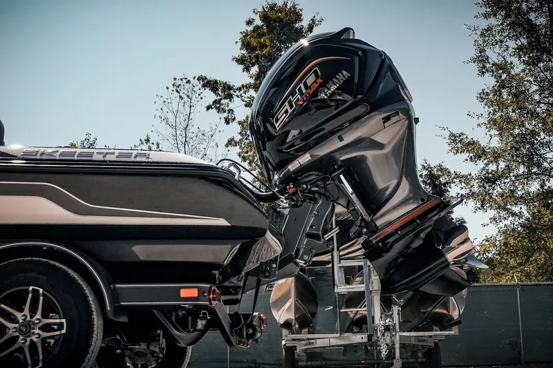 Slide: The Image of 2024 Skeeter ZX200 boat with powerful Yamaha outboard motor, parked outdoors. - 22