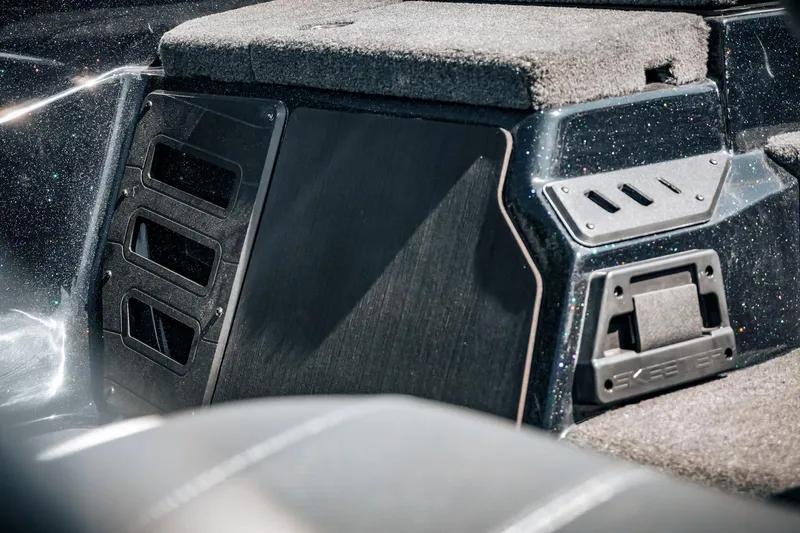 Slide: The Image of 2024 Skeeter ZX200 boat interior with carpeted surfaces and storage compartments. - 26