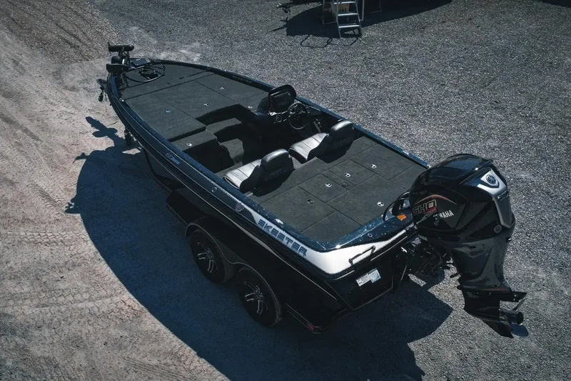 Slide: The Image of 2024 Skeeter ZX200 boat with Yamaha engine, parked on gravel surface. - 3