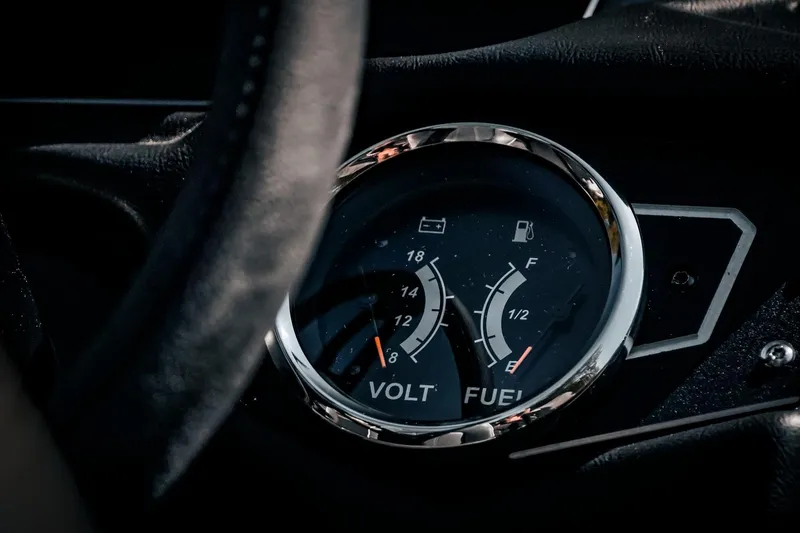 Slide: The Image of 2024 Skeeter ZX200 dashboard showing volt and fuel gauges. - 30