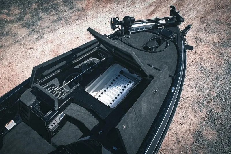 Slide: The Image of 2024 Skeeter ZX200 boat interior with storage compartments and fishing gear. - 6