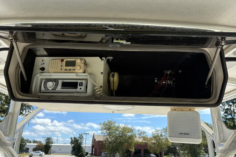 Slide: The Image of 2004 Sea Chaser 2300 Offshore boat electronics compartment with radio and communication equipment. - 11