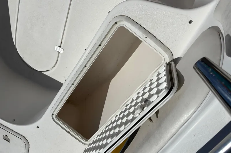 Slide: The Image of Open storage compartment on a 2004 Sea Chaser 2300 Offshore boat. - 13